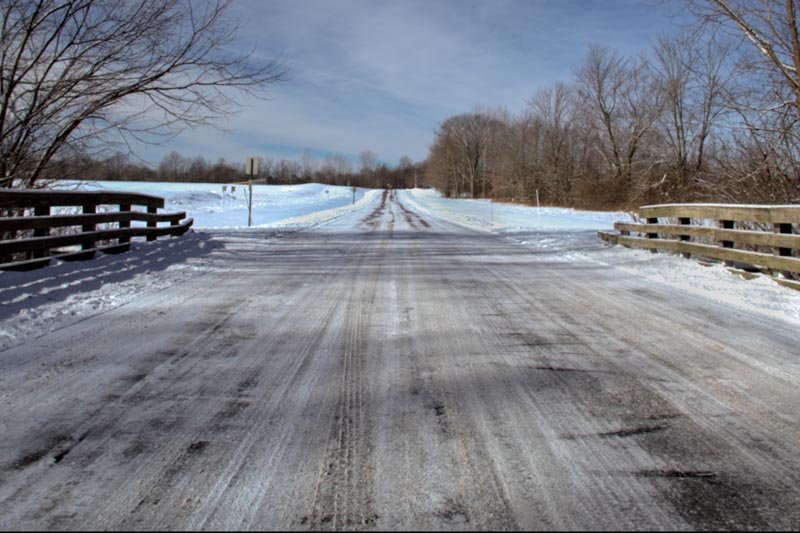 Crossing the Black River Bridge to the horse trail